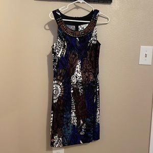 Sleeveless dress, beaded neckline